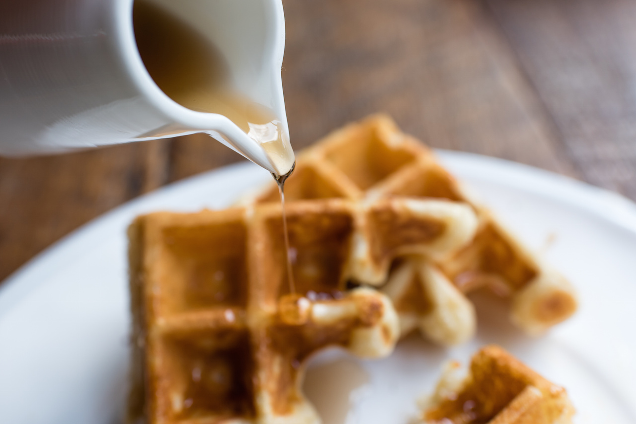 Waffle with Pouring Maple Syrup